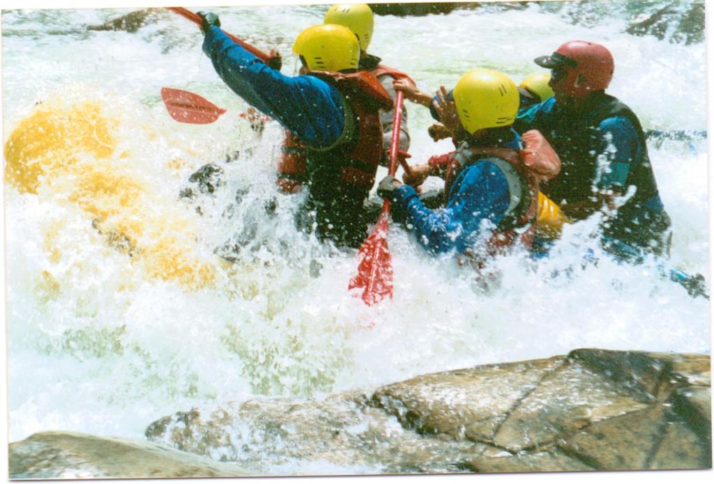 A raft almost inundated with white water, Upper Animas River, Colorado